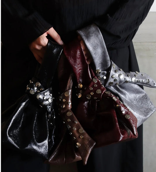 PV Bolso Remaches Muñequera